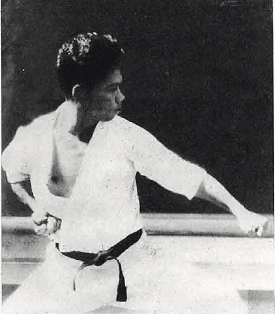 Master Yoshitaka Funakoshi low downward block in wide horse stance kiba-dachi